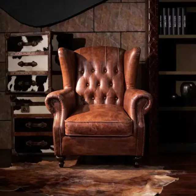 Fauteuil à oreilles Chesterfield Putney en cuir marron vieilli